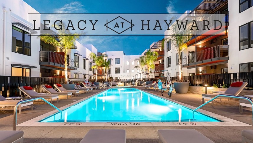 Buildings around a pool at Legacy at Hayward